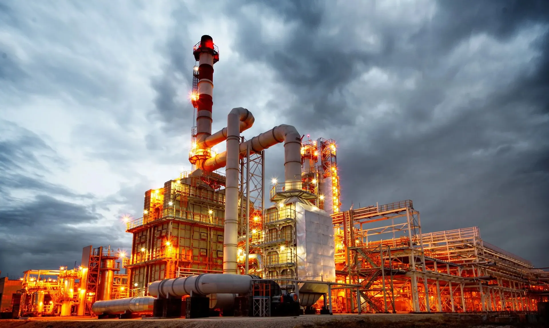 Oil and gas processing plant with pipework, columns and a flare stack